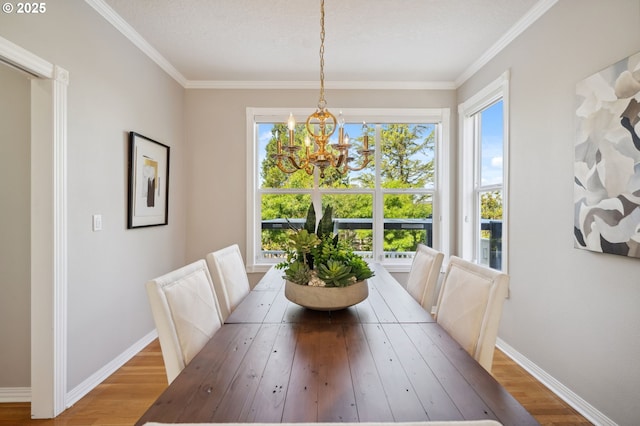 1365 NW 96th Ave, Portland, OR 97229 - dining space with a chandelier, wood finished floors, plenty of natural light, baseboards, and crown molding