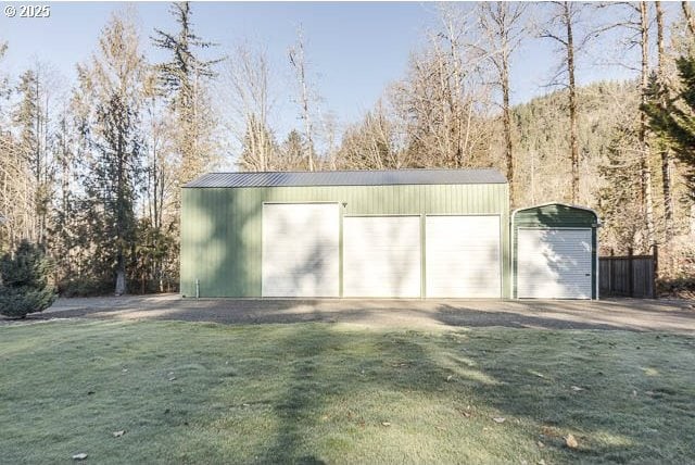 garage featuring a yard