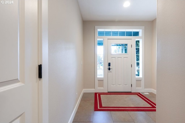 foyer with tile patterned flooring