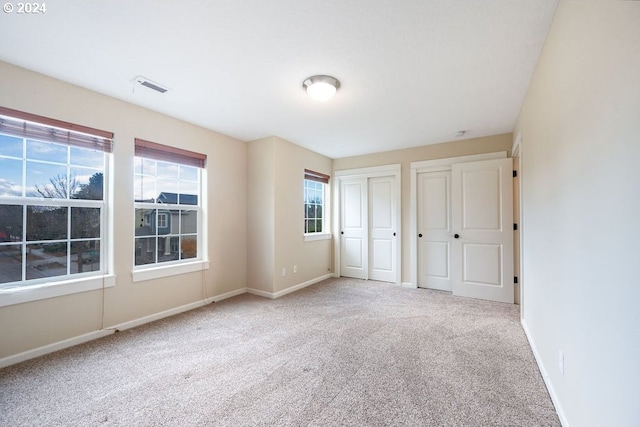 unfurnished bedroom with carpet floors