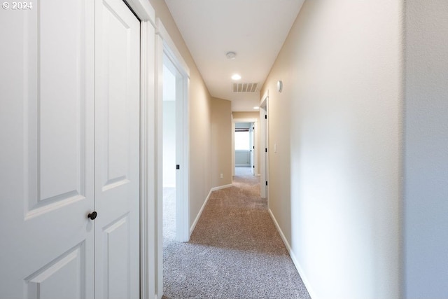 hallway with light carpet