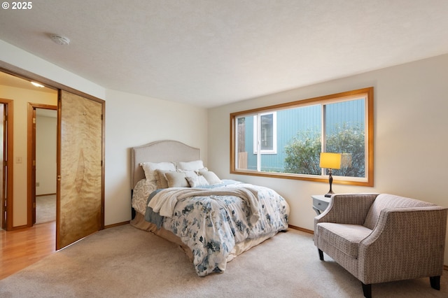bedroom featuring light colored carpet