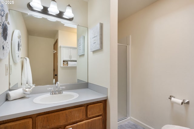 full bathroom featuring a shower stall and vanity