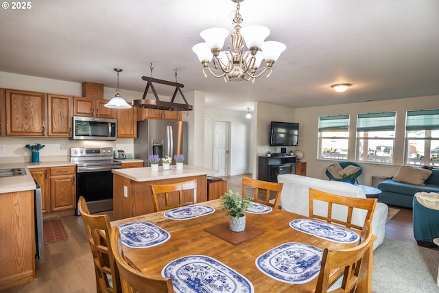 133 Bunting Ct, Roseburg, OR 97471 - dining room with a chandelier and dark wood finished floors