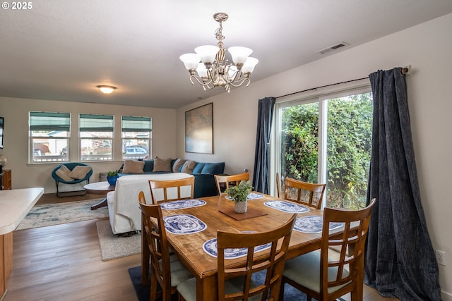 133 Bunting Ct, Roseburg, OR 97471 - dining space featuring light wood-type flooring and a chandelier