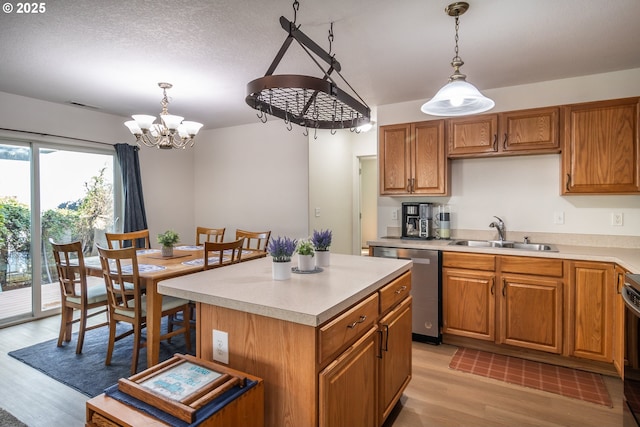 133 Bunting Ct, Roseburg, OR 97471 - kitchen featuring a sink, dishwasher, light wood-type flooring, a chandelier, and light countertops