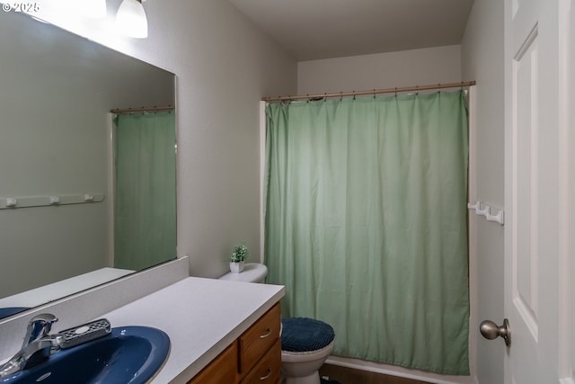 full bath with a shower with shower curtain, toilet, and vanity