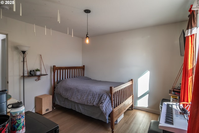 bedroom with wood finished floors