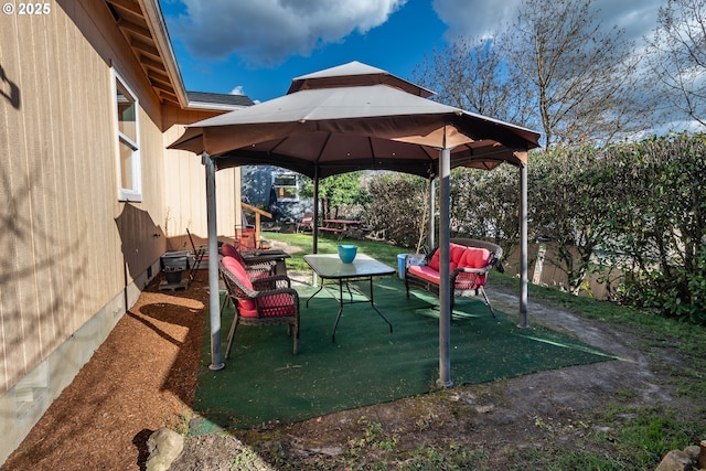 view of yard featuring a gazebo, an outdoor hangout area, a patio, and fence