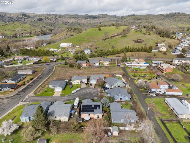 aerial view with a mountain view and a residential view