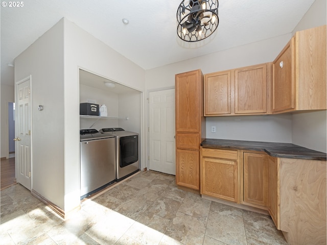 1616 Primrose Ln, Forest Grove, OR 97116 - kitchen with washing machine and dryer, stone finish floors, a chandelier, and dark countertops