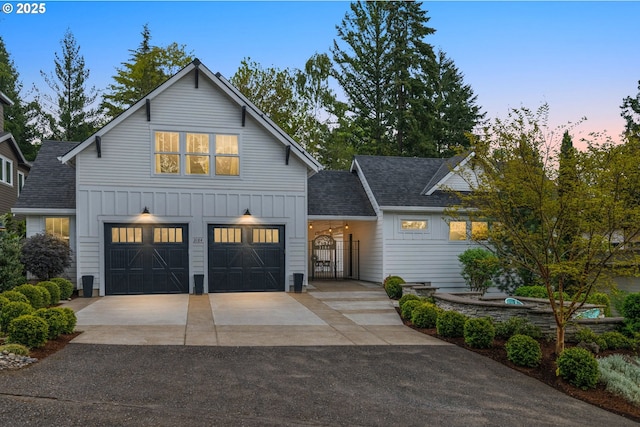 3184 SW 73rd Ave, Portland, OR 97225 - modern inspired farmhouse featuring a shingled roof, board and batten siding, a garage, and aphalt driveway