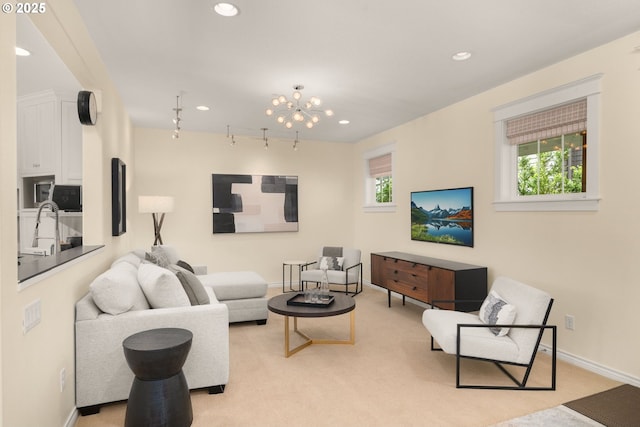 3184 SW 73rd Ave, Portland, OR 97225 - living room with baseboards, light carpet, rail lighting, and recessed lighting