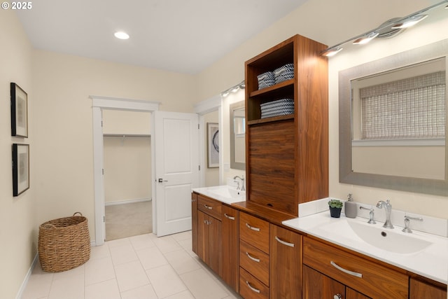 3184 SW 73rd Ave, Portland, OR 97225 - bathroom with a sink, double vanity, baseboards, and tile patterned floors