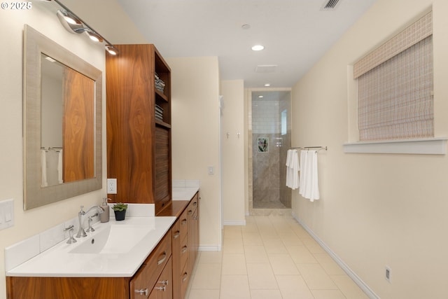 3184 SW 73rd Ave, Portland, OR 97225 - bathroom featuring tiled shower, baseboards, tile patterned flooring, vanity, and recessed lighting