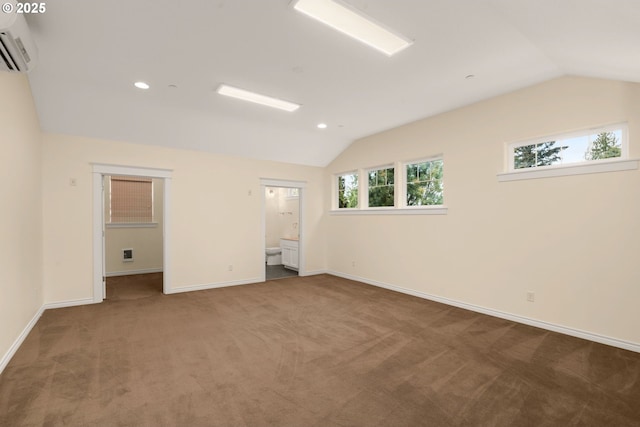 3184 SW 73rd Ave, Portland, OR 97225 - carpeted empty room with lofted ceiling, an AC wall unit, baseboards, and recessed lighting