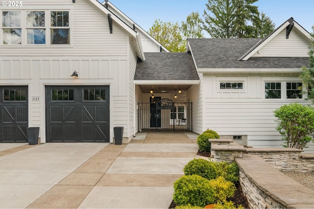 3184 SW 73rd Ave, Portland, OR 97225 - modern farmhouse featuring a garage, driveway, a shingled roof, and board and batten siding