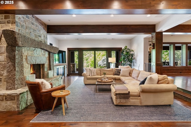 7927 NW Hawkins Blvd, Portland, OR 97229 - living room with beam ceiling, hardwood / wood-style floors, a stone fireplace, and recessed lighting
