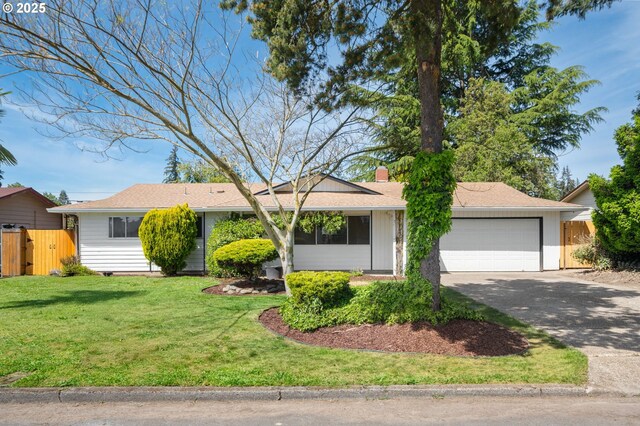 single story home with concrete driveway, a garage, and a chimney
