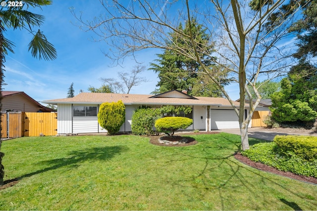 ranch-style house featuring a garage, asphalt driveway, board and batten siding, and a gate