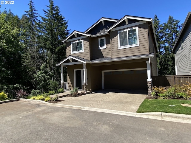 9537 SW 171st Ave, Beaverton, OR 97007 - craftsman inspired home featuring an attached garage, board and batten siding, and concrete driveway