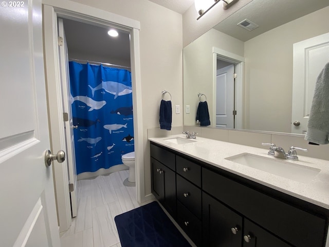 9537 SW 171st Ave, Beaverton, OR 97007 - full bathroom featuring double vanity, toilet, and curtained shower