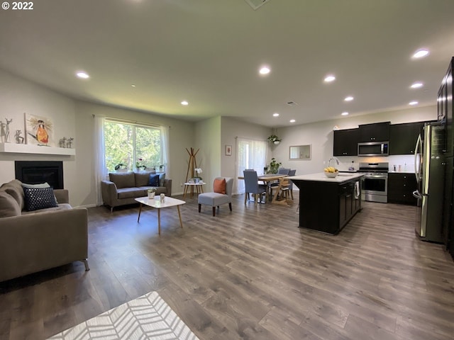 9537 SW 171st Ave, Beaverton, OR 97007 - living room with wood finished floors, a fireplace, and recessed lighting