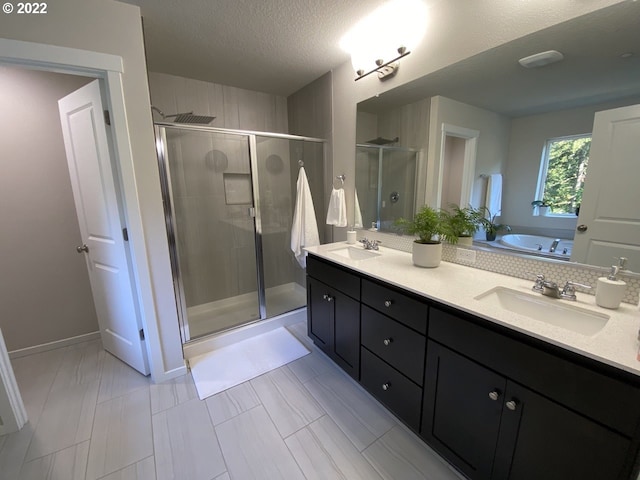 9537 SW 171st Ave, Beaverton, OR 97007 - bathroom with a shower stall, a bath, double vanity, and a textured ceiling