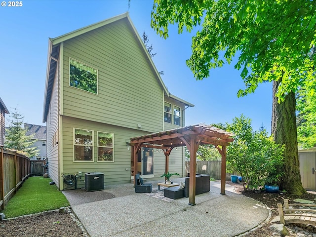 back of house featuring a fenced backyard, a pergola, central AC unit, and a patio area