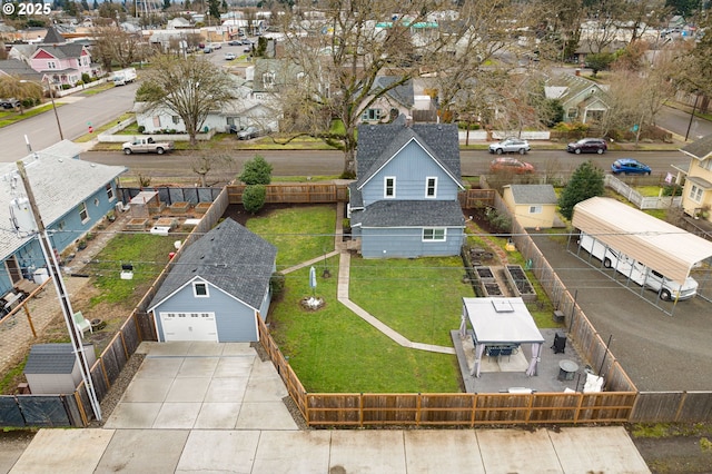 birds eye view of property with a residential view