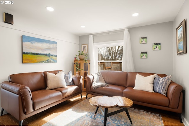 living area featuring wood finished floors and recessed lighting