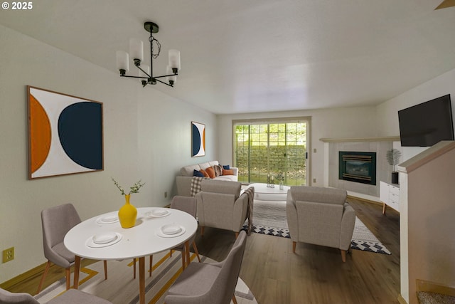4001 12th St Cut Off SE Unit 18, Salem, OR 97302 - dining room featuring a chandelier, wood finished floors, a tiled fireplace, and baseboards