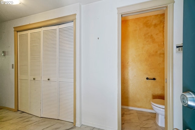4001 12th St Cut Off SE Unit 18, Salem, OR 97302 - bathroom featuring marble look tiles, toilet, and baseboards