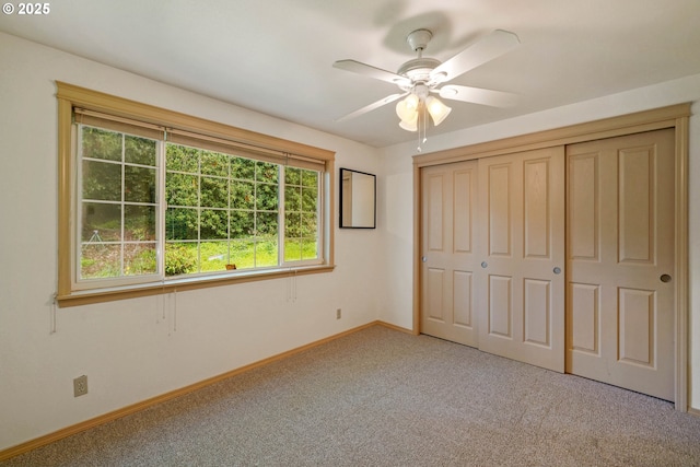 4001 12th St Cut Off SE Unit 18, Salem, OR 97302 - unfurnished bedroom featuring light carpet, baseboards, a closet, and a ceiling fan