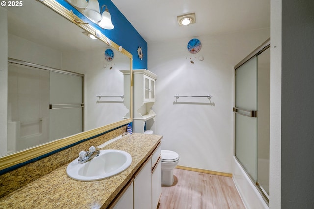 4001 12th St Cut Off SE Unit 18, Salem, OR 97302 - full bath featuring wood finished floors, toilet, vanity, and baseboards