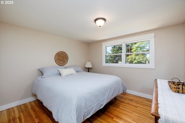 1375 NW Murray Rd, Portland, OR 97229 - bedroom featuring baseboards and wood finished floors