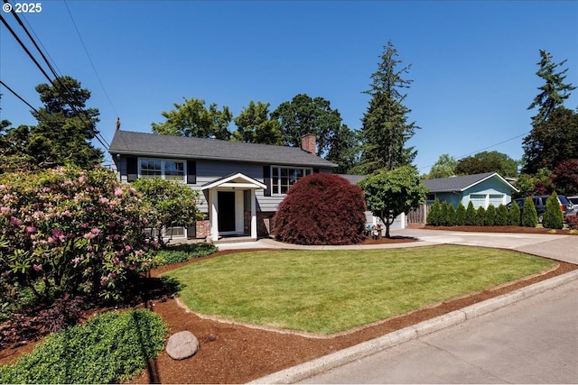 1375 NW Murray Rd, Portland, OR 97229 - raised ranch with driveway, a chimney, a front lawn, and brick siding