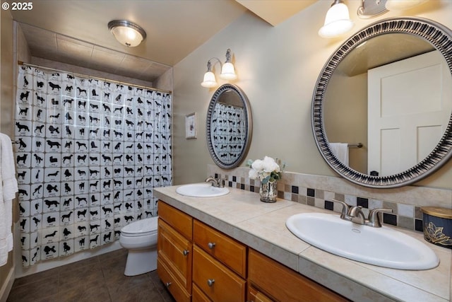 1375 NW Murray Rd, Portland, OR 97229 - full bathroom featuring toilet, double vanity, tile patterned floors, a shower with shower curtain, and tasteful backsplash