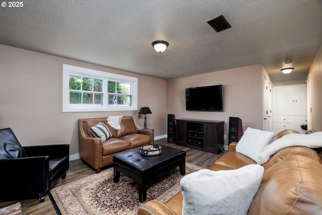 1375 NW Murray Rd, Portland, OR 97229 - living area with wood finished floors, baseboards, and a textured ceiling
