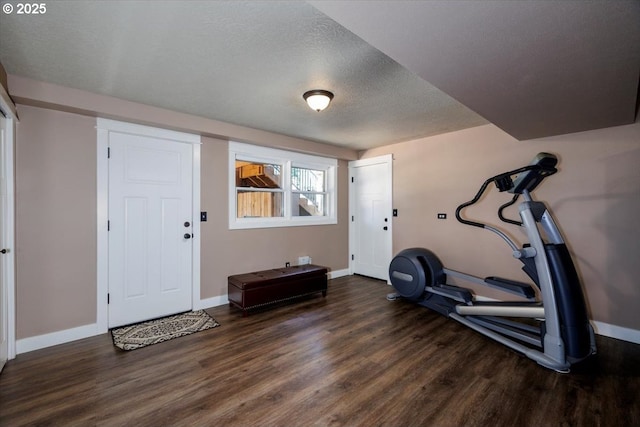 1375 NW Murray Rd, Portland, OR 97229 - exercise room featuring wood finished floors, baseboards, and a textured ceiling