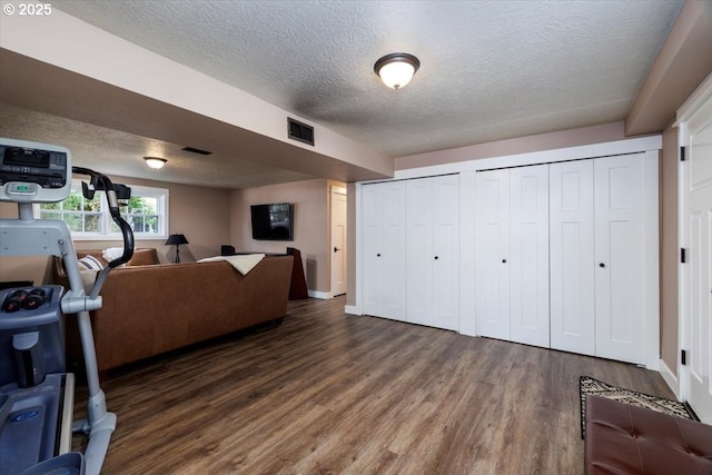 1375 NW Murray Rd, Portland, OR 97229 - living room with a textured ceiling, wood finished floors, and baseboards