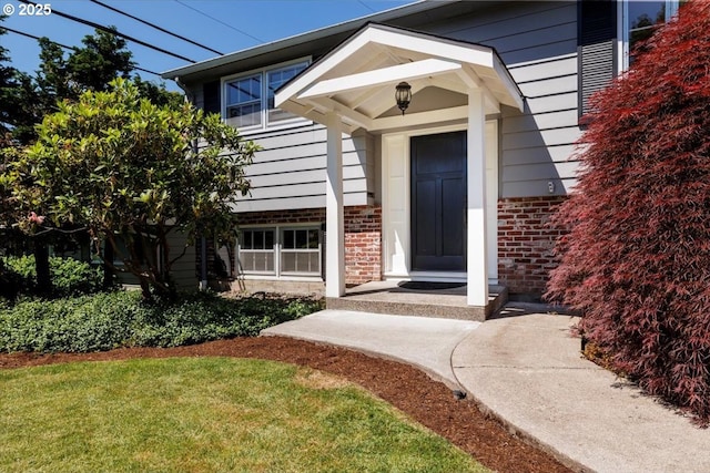 1375 NW Murray Rd, Portland, OR 97229 - property entrance with brick siding and a yard