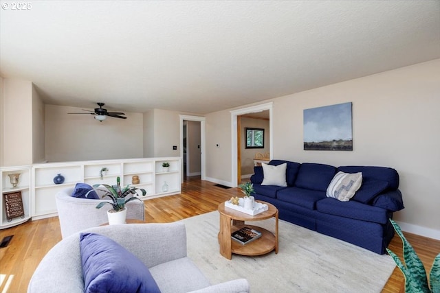 1375 NW Murray Rd, Portland, OR 97229 - living room featuring wood finished floors, ceiling fan, and baseboards