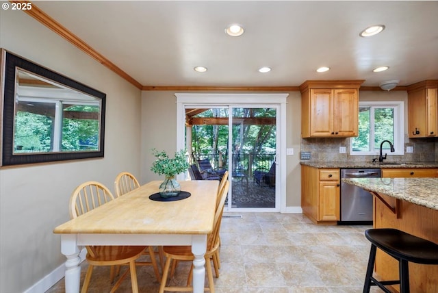 1375 NW Murray Rd, Portland, OR 97229 - kitchen with stainless steel dishwasher, baseboards, light stone counters, ornamental molding, and tasteful backsplash