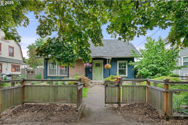 165 15th St, Salem, OR 97301 - view of front of home with roof with shingles and brick siding