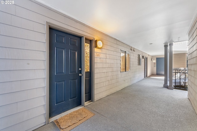 entrance to property featuring covered porch