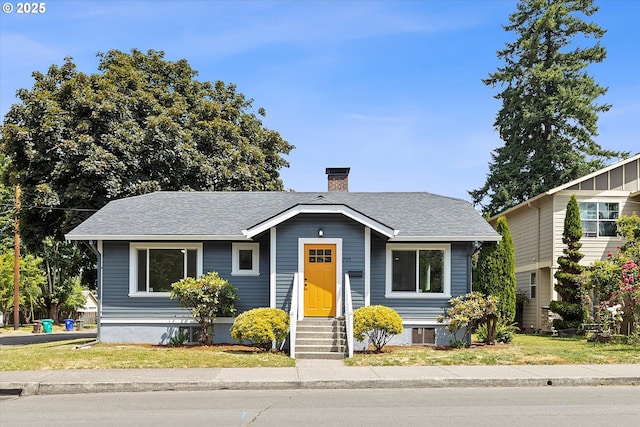 705 SE 5th St, Gresham, OR 97080 - bungalow-style home featuring a chimney, entry steps, roof with shingles, and a front yard