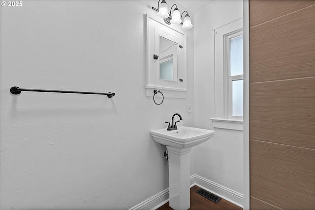 705 SE 5th St, Gresham, OR 97080 - bathroom with baseboards and wood finished floors
