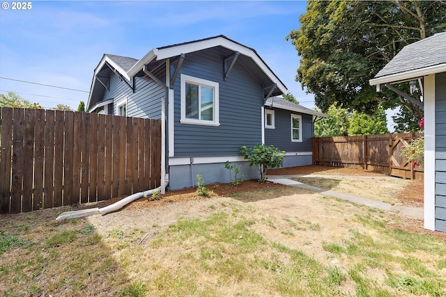 705 SE 5th St, Gresham, OR 97080 - view of side of home featuring a fenced backyard