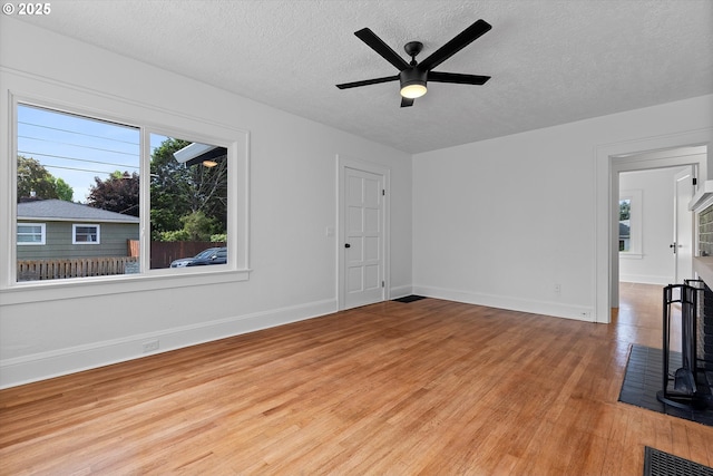 705 SE 5th St, Gresham, OR 97080 - unfurnished room with a textured ceiling, light wood finished floors, and a ceiling fan